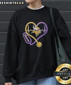 Alt Text: Top Nurse Heartbeat X Minnesota Vikings Logo Sweatshirt featuring vibrant team colors and a stylish design.