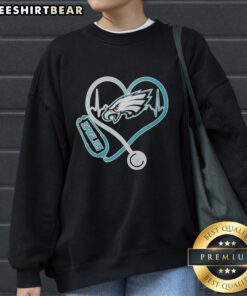 Top Nurse Heartbeat X Philadelphia Eagles logo sweatshirt for nurses and football fans, combining style and team spirit.