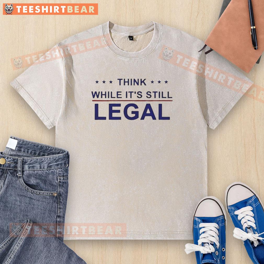 Top Think While It's Still Legal washed t-shirt featuring a bold graphic design and soft fabric, perfect for casual wear.