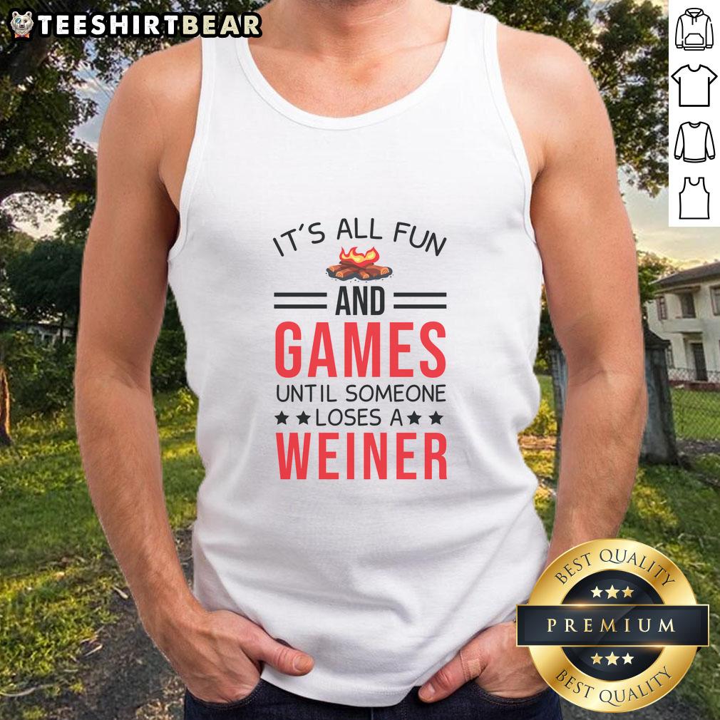 Awesome gamer camping in a fun setting, wearing 'It's All Fun and Games Until Someone Loses a Wiener' tank top.