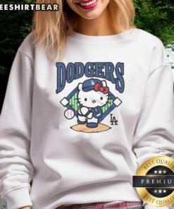 Awesome Hello Kitty x Los Angeles Dodgers first pitch sweatshirt featuring playful design and vibrant team colors.