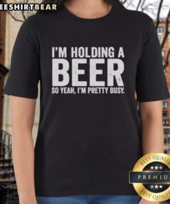 Fun ladies tee with 'Awesome I'm Holding A Beer' slogan, perfect for casual outings and showcasing your busy lifestyle.