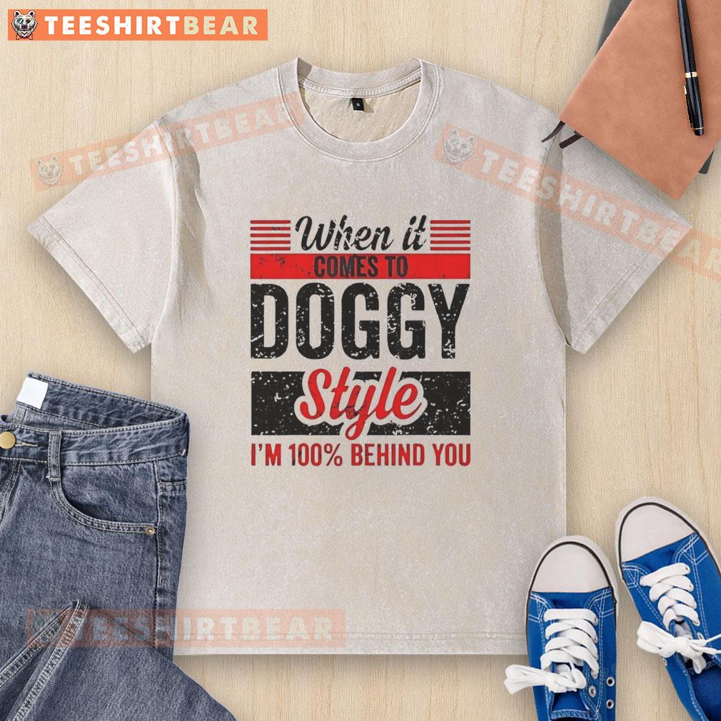 Retro washed t-shirt with '100% Behind You' dog graphic, perfect for dog lovers and casual wear enthusiasts.