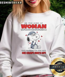 Funny Snoopy sweatshirt with the phrase 'Be the kind of woman that when your feet hit the floor' in vibrant colors.