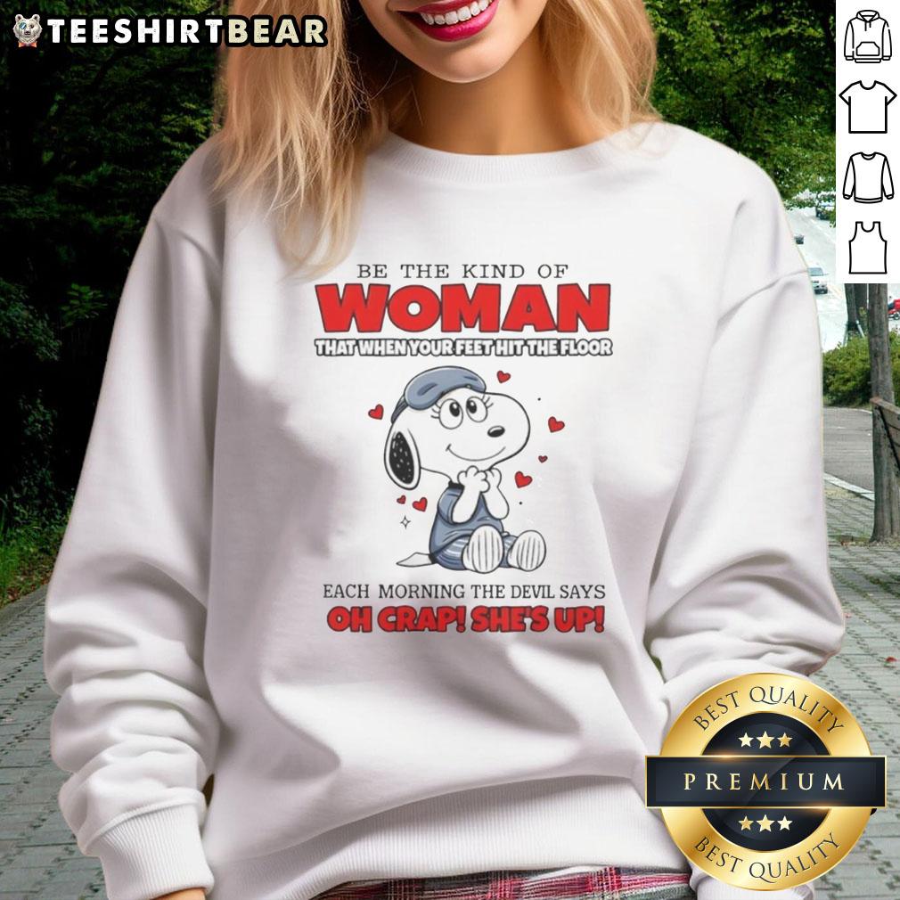 Funny Snoopy sweatshirt with the phrase 'Be the kind of woman that when your feet hit the floor' in vibrant colors.