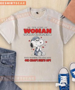 Funny Snoopy t-shirt featuring the quote 'Be the kind of woman that when your feet hit the floor' in vibrant colors.