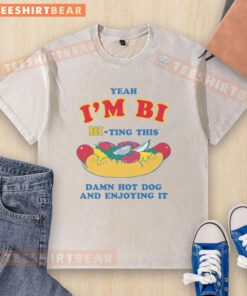 Alt Text: Person in a washed t-shirt enjoying a hot dog with a funny expression, showcasing the 'Funny Yeah, I'm Bi' theme.