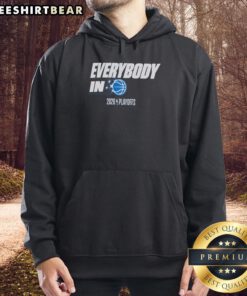 Orlando Magic fans in hoodies celebrate during the 2026 NBA Playoffs, showcasing team spirit and excitement.