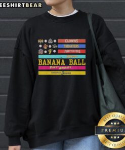Alt Text: Good Savannah Bananas sweatshirt featuring clowns, tailgaters, firefighters, and American flag design.