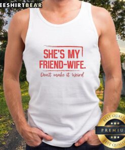 Alt Text: Woman wearing a Good Shes My Friend Wife Don't Make It Weird tank top, smiling outdoors in a casual setting.