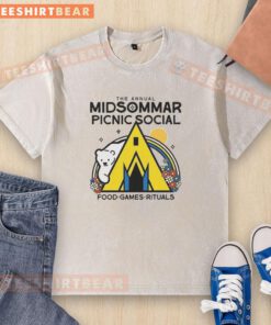 Good Midsommar picnic with social food and games, featuring a washed T-shirt in a vibrant outdoor setting.
