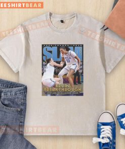 Alt Text: UCLA Bruins 2026 Women's Basketball National Champions poster on a washed t-shirt, celebrating their victory.