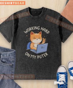 Person wearing a 'Good Working Hard On My Computer' washed t-shirt while focused on laptop, showcasing work-from-home vibes.