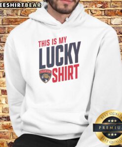 Person wearing a Florida Panthers hoodie, showcasing team pride and luck during a game day in sunny Florida.