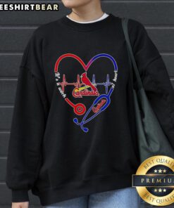 Alt Text: Hot St. Louis Cardinals sweatshirt featuring a stethoscope and heartbeat shape design, perfect for fans and health enthusiasts.