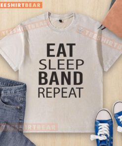 Alt Text: Nice band Eat Sleep Repeat musician in a washed t-shirt, showcasing a relaxed style and passion for music.