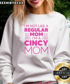 Mom wearing 'Nice, I'm Not Like A Regular Mom' sweatshirt, showcasing a fun and trendy style for unique moms.