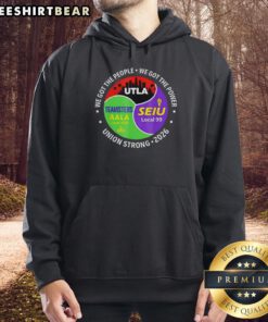Original Labor Movement hoodie featuring Utla SEIU Aala design against a city skyline backdrop, promoting workers' rights.