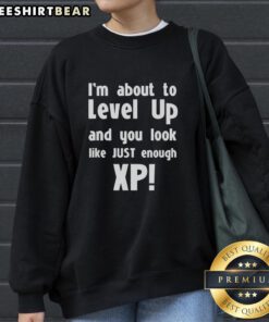 Premium sweatshirt featuring 'About to Level Up' design, perfect for gamers seeking stylish XP-themed apparel.