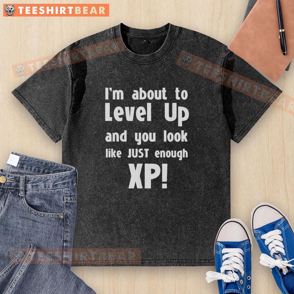 Premium washed t-shirt featuring 'About to Level Up' design, perfect for gamers seeking stylish XP-themed apparel.