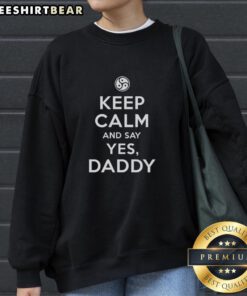 Stylish 'Keep Calm And Say Yes Daddy' sweatshirt in a cozy setting, perfect for casual wear and playful expression.