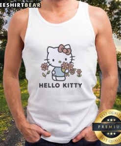 Pretty Snl Jane Wickline wearing a Sanrio Old Navy Hello Kitty garment dyed tank top in a vibrant outdoor setting.