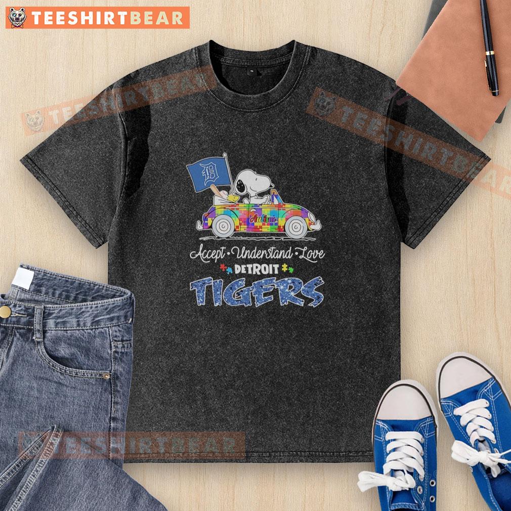 Snoopy and Woodstock driving a car on a Detroit Tigers t-shirt promoting autism acceptance and love.