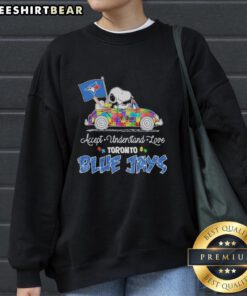 Cute Snoopy and Woodstock driving a car on a Toronto Blue Jays sweatshirt promoting autism acceptance and love.