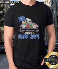 Pretty Snoopy and Woodstock driving a car on a Toronto Blue Jays T-shirt promoting autism acceptance and love.