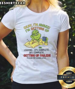 Funny Grinch graphic tee for women with 'Okay, I'm Awake, I'm Getting Up' design, perfect for holiday cheer.