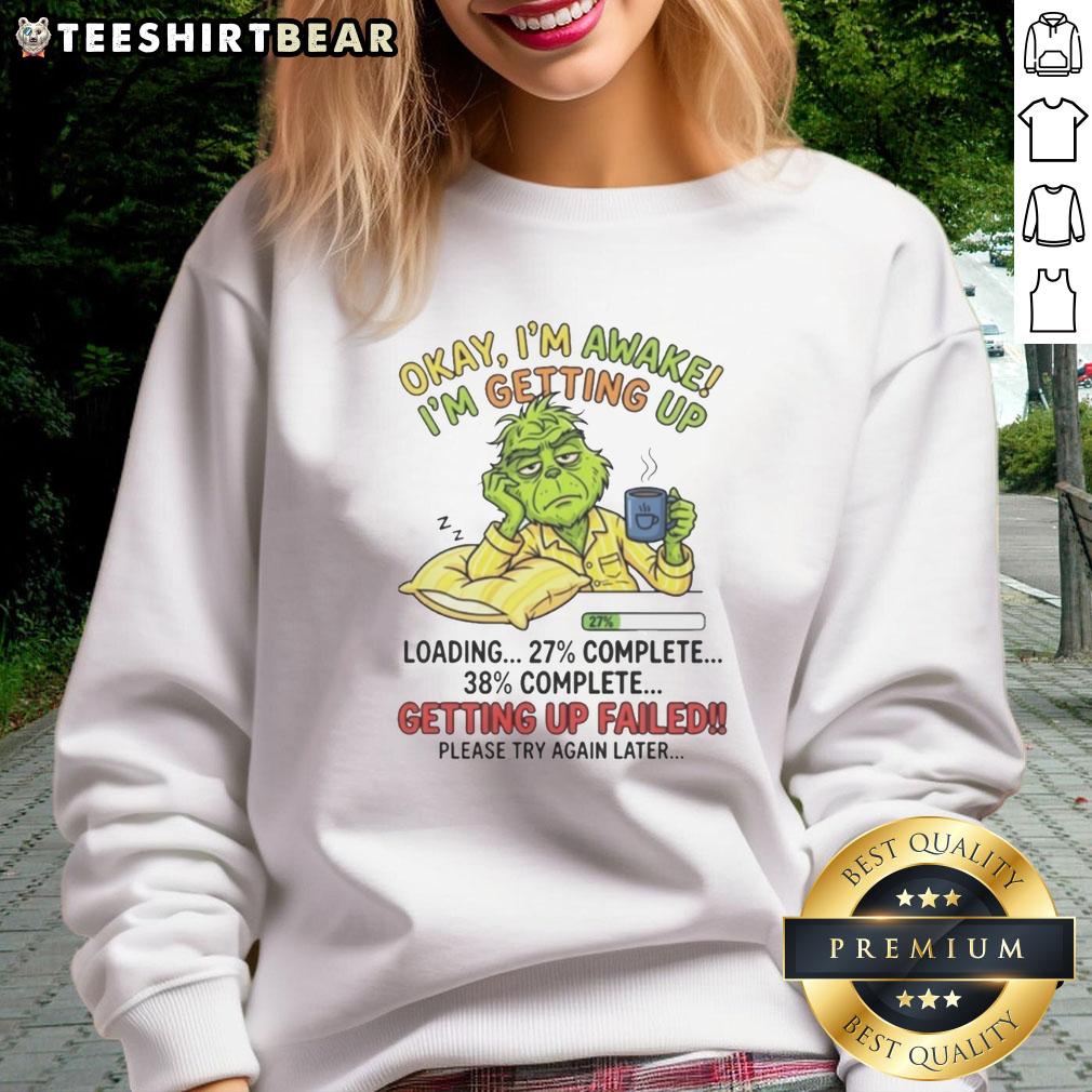 Cozy Top Grinch sweatshirt featuring 'Okay, I'm awake, I'm getting up' design, perfect for holiday cheer and comfort.