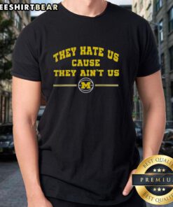 Top Michigan Wolverines Basketball 'They Hate Us Cause They Ain't Us' T-shirt design featuring bold team colors and logo.