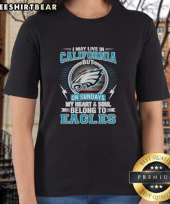 Alt Text: Top Philadelphia Eagles ladies tee: 'I May Live In California But My Heart Belongs To Eagles' design.