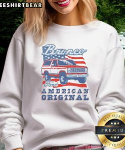 Vintage sweatshirt featuring Awesome Ford Bronco design with American flag, perfect for car enthusiasts and retro style lovers.