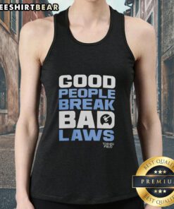 Topher Field wearing a tank top with 'Awesome Good People Break Bad Laws' slogan, promoting free speech and activism.