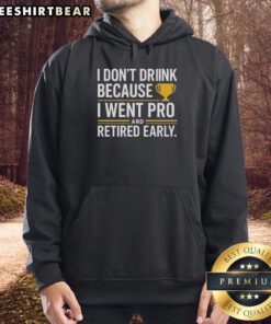 Person wearing a yellow hoodie with 'I Dont Drink, I Went Pro and Retired Early' slogan, showcasing a unique trophy design.