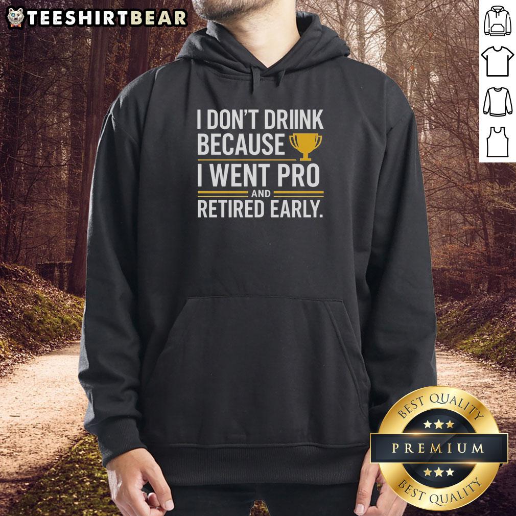 Person wearing a yellow hoodie with 'I Dont Drink, I Went Pro and Retired Early' slogan, showcasing a unique trophy design.