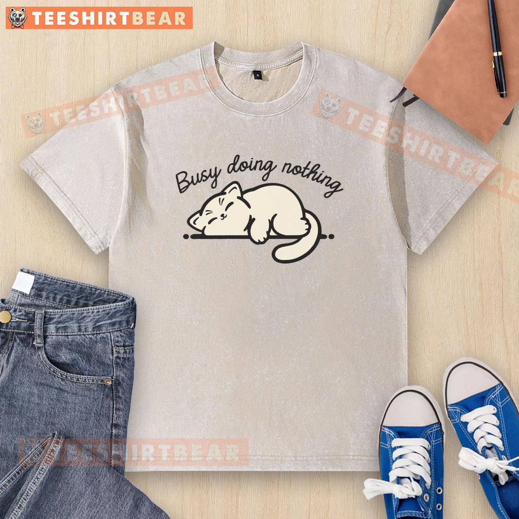 Adorable cute kitty lounging in a cozy spot, wearing a washed t-shirt, embodying the art of doing nothing.