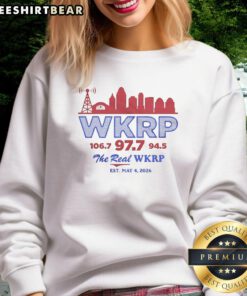 Funny WKRP retro sweatshirt featuring city skyline design, promoting 106.7, 97.7, and 94.5, established May 4, 2026.