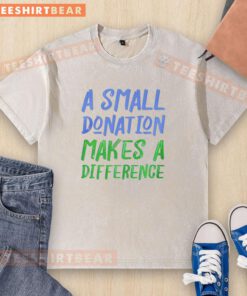 Alt Text: Good A Small Donation Makes A Difference washed t-shirt featuring a motivational message on a casual background.