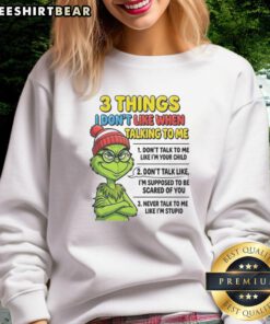 Good Grinch sweatshirt featuring '3 Things I Don't Like When Talking to Me' design, perfect for holiday humor lovers.