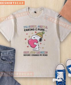 Model wearing a 'Hot I'm Sweet Gentle Caring Pure Okay Stop Laughing Before I Change My Mind' t-shirt, showcasing style.