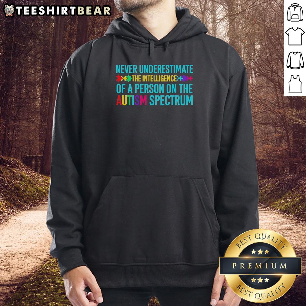 Hot hoodie featuring the phrase 'Never Underestimate the Intelligence of a Person on the Autism Spectrum' in bold print.