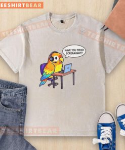 Graphic design on a washed t-shirt with the phrase 'Have You Tried Screaming' in bold colors, perfect for casual wear.