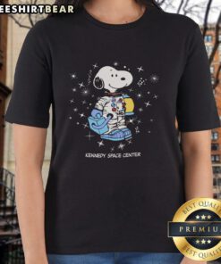 Nice Peanuts Snoopy Galaxy graphic on a Kennedy Space Center ladies tee, perfect for fans of space and classic cartoons.