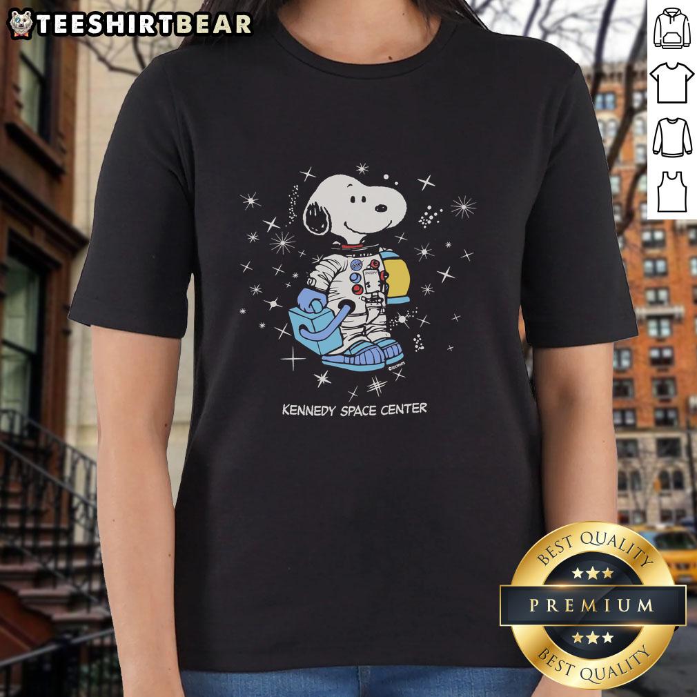 Nice Peanuts Snoopy Galaxy graphic on a Kennedy Space Center ladies tee, perfect for fans of space and classic cartoons.