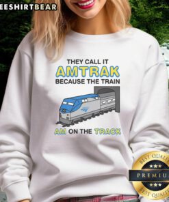 Alt Text: Cozy 'Nice They Call It Name Because The Train Am On The Track' sweatshirt in a stylish casual setting.