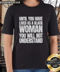 Black woman wearing 'Nice Until You Have Lived As A Black Woman' tee, showcasing empowerment and resilience.