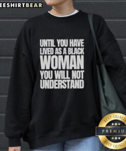 Black woman wearing 'Nice Until You Have Lived As A Black Woman' sweatshirt, showcasing empowerment and resilience.