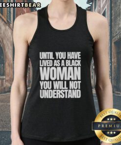 Black woman wearing a 'Nice Until You Have Lived as a Black Woman' tank top, showcasing empowerment and identity.